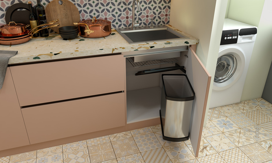 Modern stainless steel kitchen sink features a base cabinet with pull-out bins