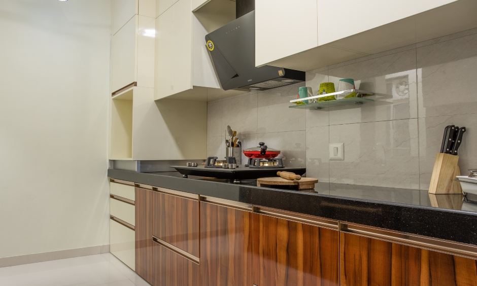 Modular kitchen design in white and wood finish laminates by top interior contractors in mumbai