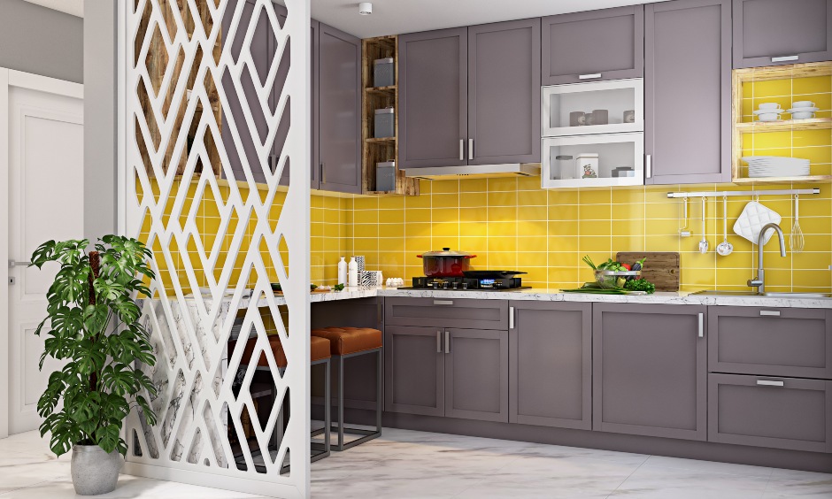 Modular kitchen designed in grey with metal handles in 1bhk house design