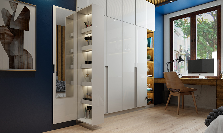 Multifunctional wardrobe with a dresser unit is a smart space saving design for small indian homes