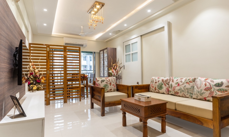 Mumbai flats interior design designed with a traditional sofa set, an intricate foldable jali partition
