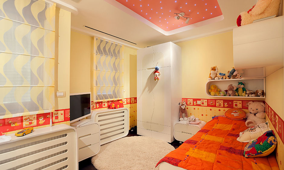 Vibrant kids' bedroom with an orange pop design colour combination with white creates a lively atmosphere