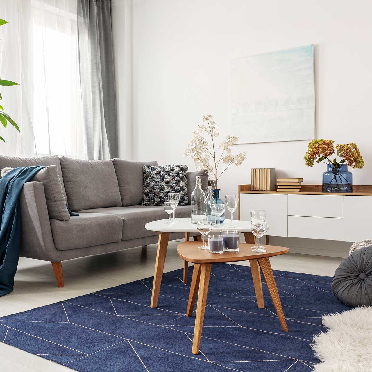 Living room interior decor with blue rug