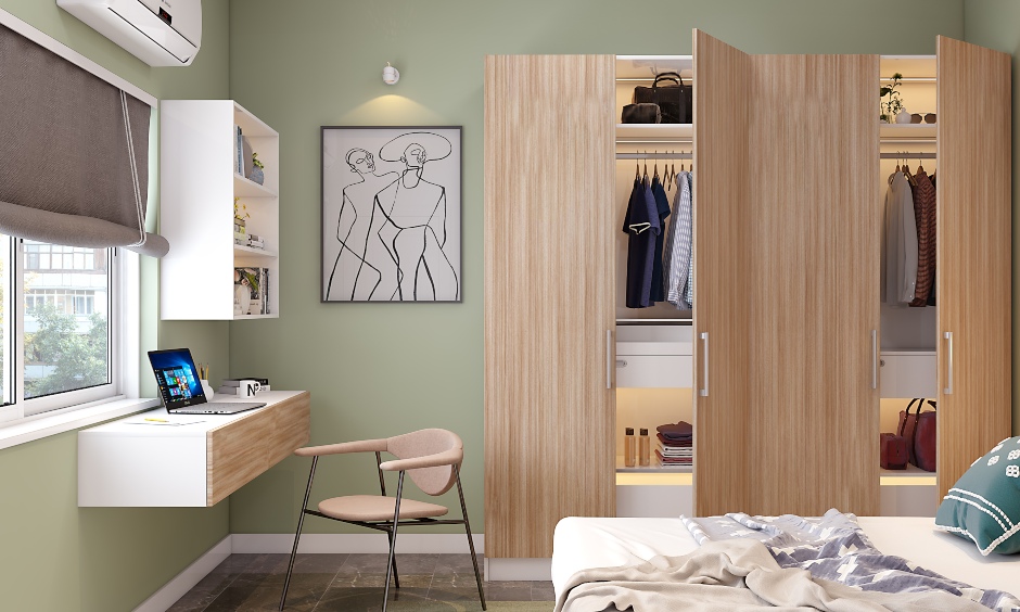 The small bedroom design features a 4-door wardrobe and study unit