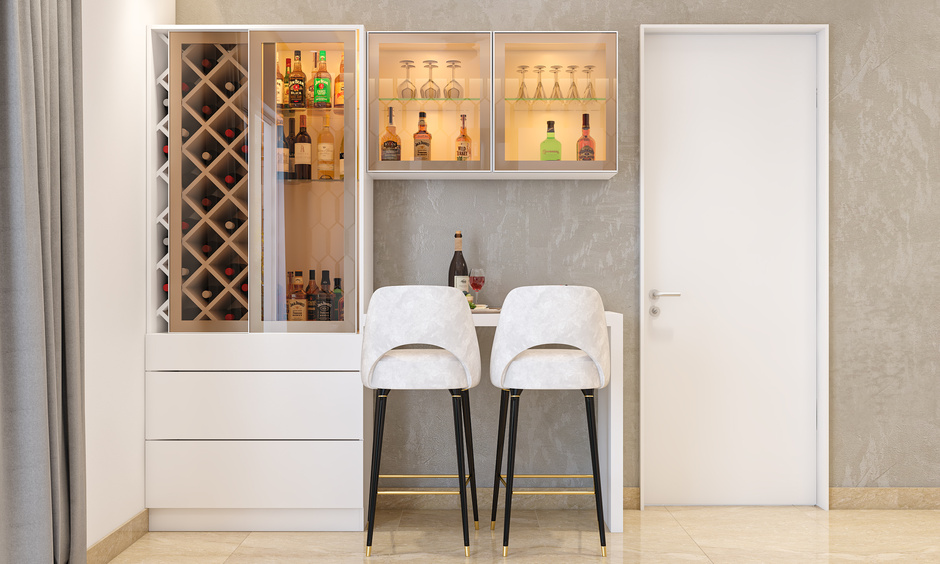 White-themed small studio apartment decor features a convertible workspace/home bar