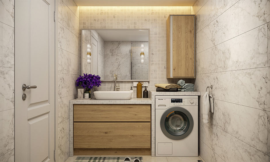 Space-saving bathroom design with a vanity unit and a dedicated space for washing machine
