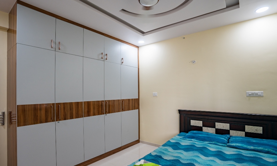 Space-saving interiors with a gorgeous false ceiling and a floor-to-ceiling designed by low cost interior designers in hyderabad