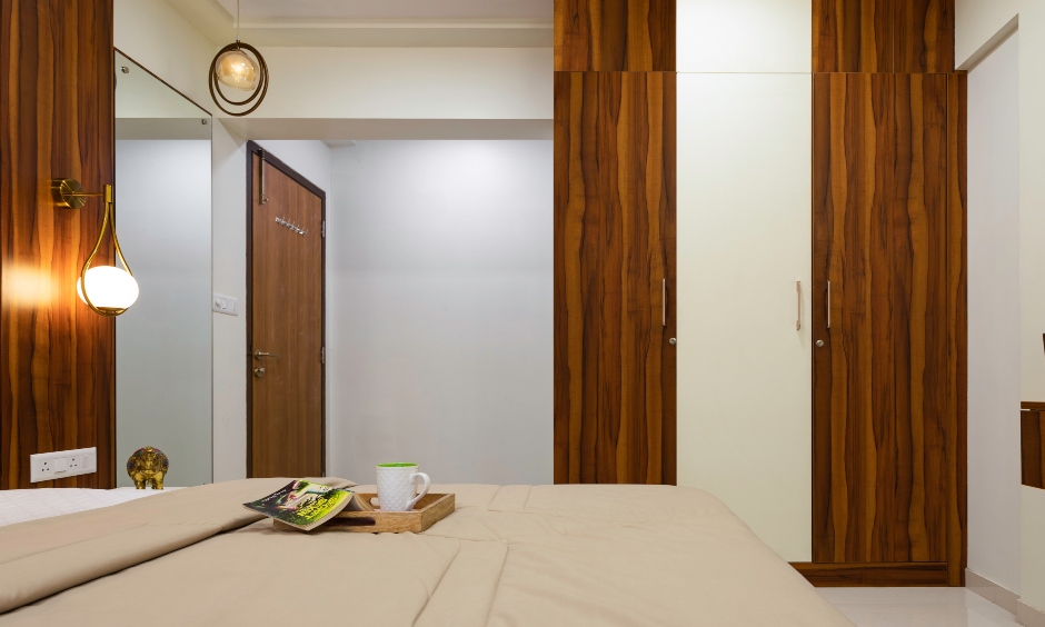 Traditional cum modern design layout with a floor-to-ceiling wooden wardrobe by interior contractor in mumbai