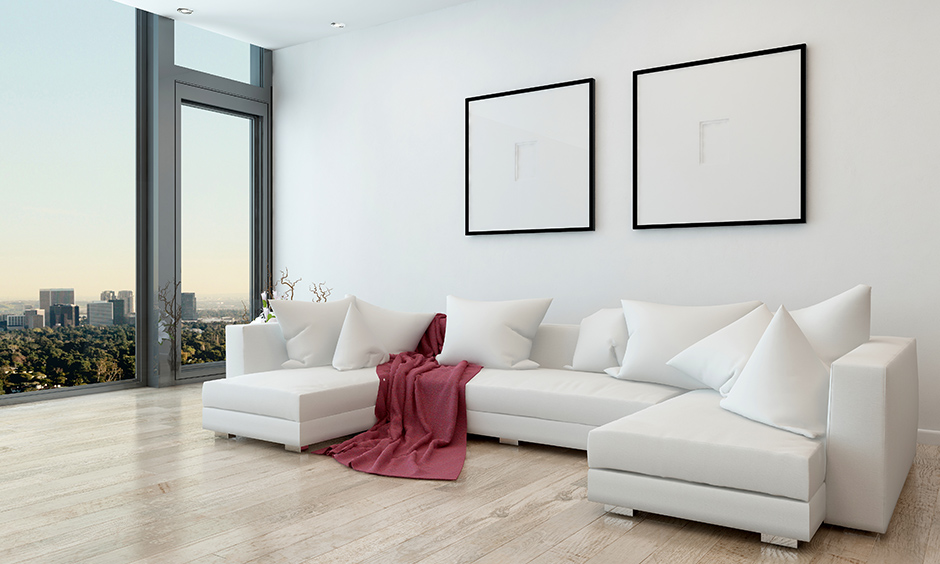 U-shaped designer sectional sofas in white coloured add aesthetics of your living room.
