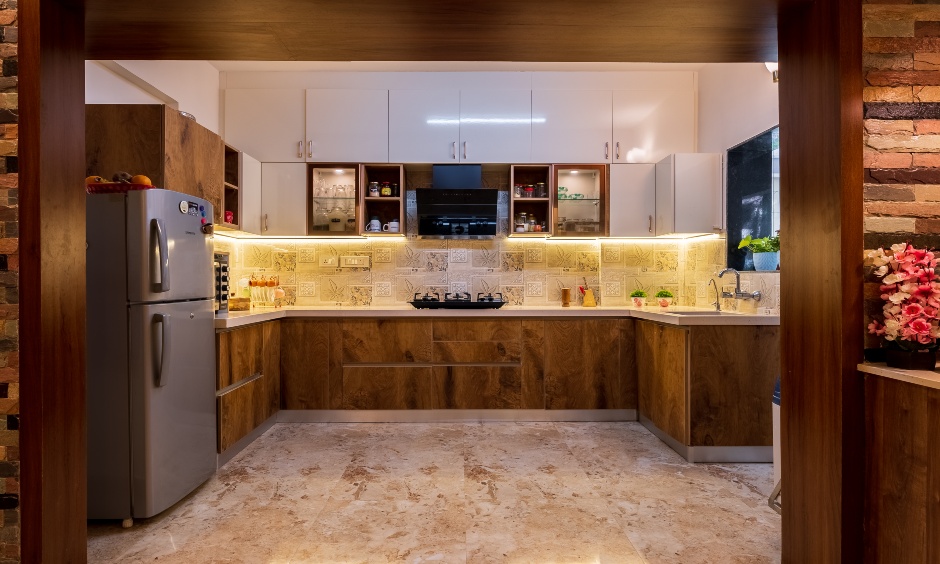 The U-shaped kitchen interior features a chic tiled backsplash by Designcafe in Bellandur, Bangalore