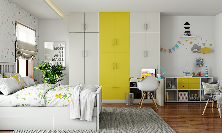 Yellow and white wardrobe for kids bedroom designed to be accessible, low on maintenance and high on storage.
