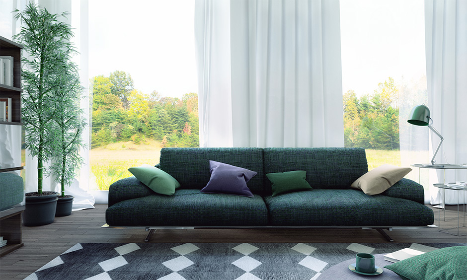 A wide compact sofa in green is perfect for tiny family & doubles up as a sofa bed are sectional sofa design ideas.
