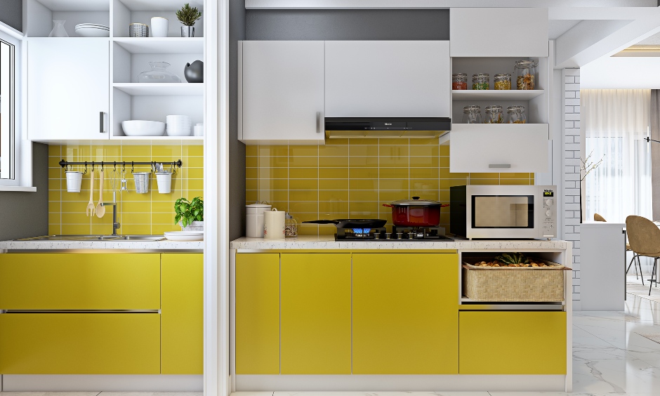 Parallel kitchen in yellow and white combination in 3 bhk home designed in india